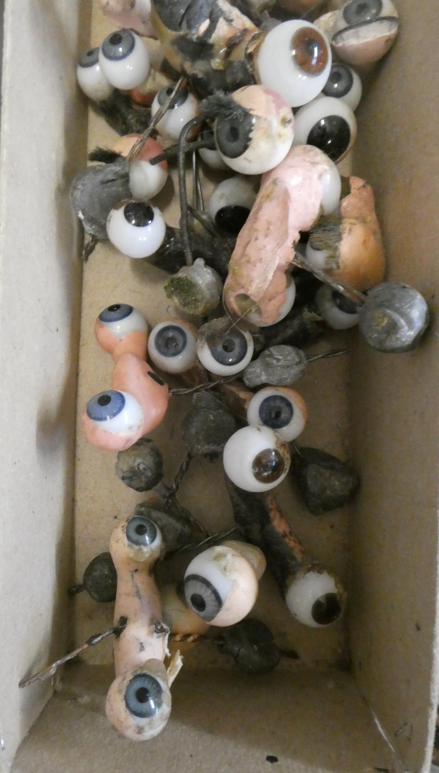 Twenty five pairs of doll's eyes on rockers, and other assorted eyes Image