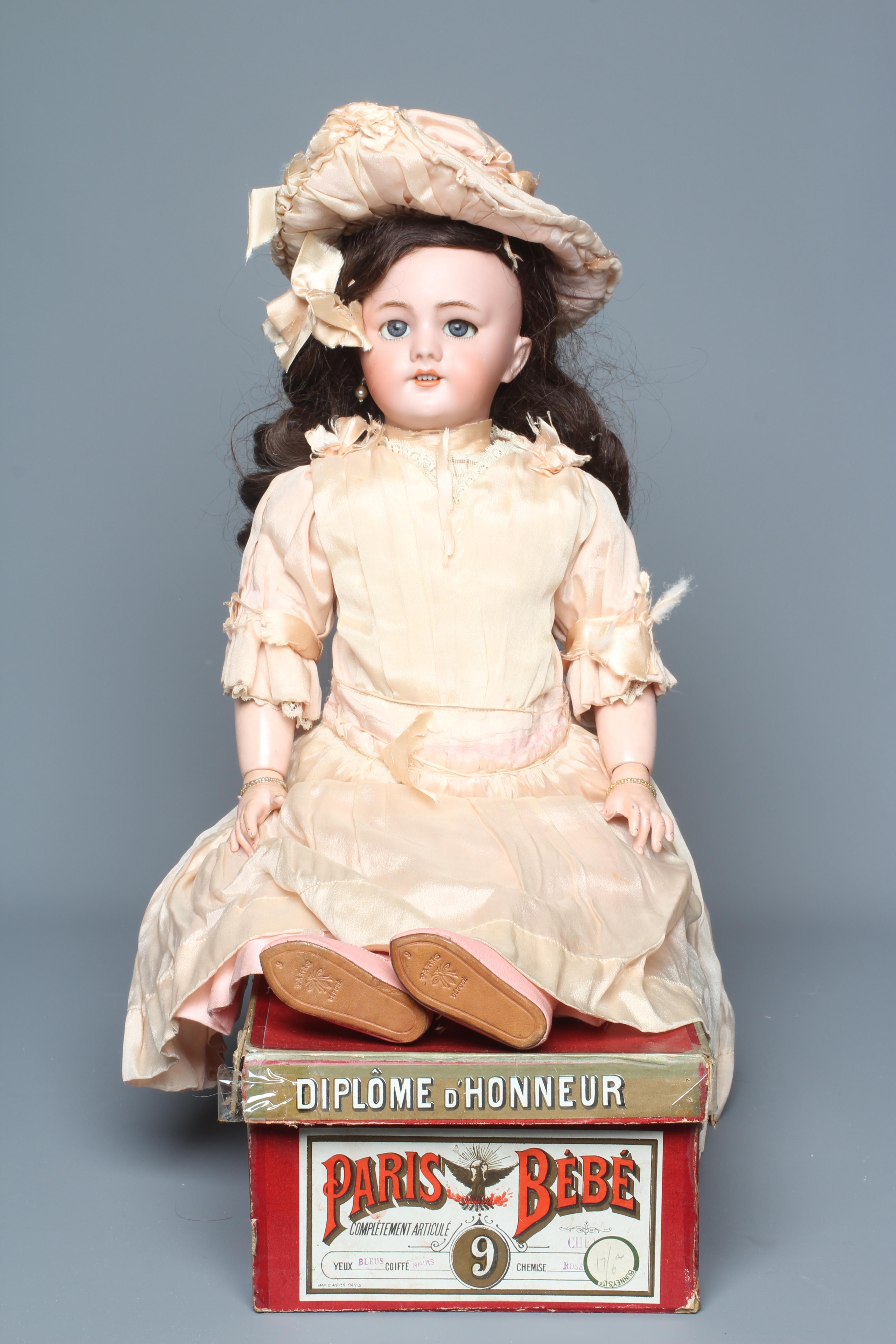 A French boxed Paris Bebe bisque socket head doll Image