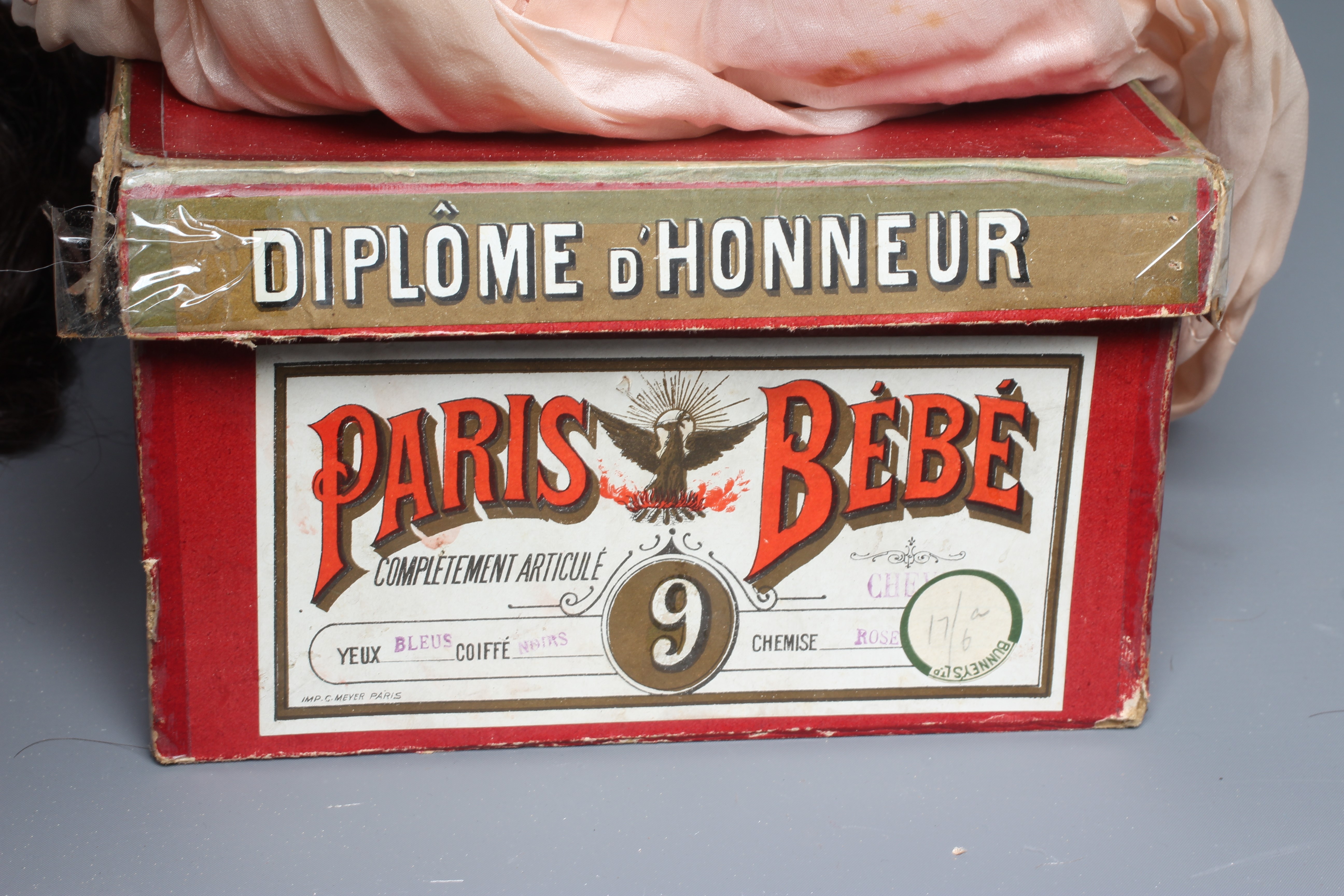 A French boxed Paris Bebe bisque socket head doll Image