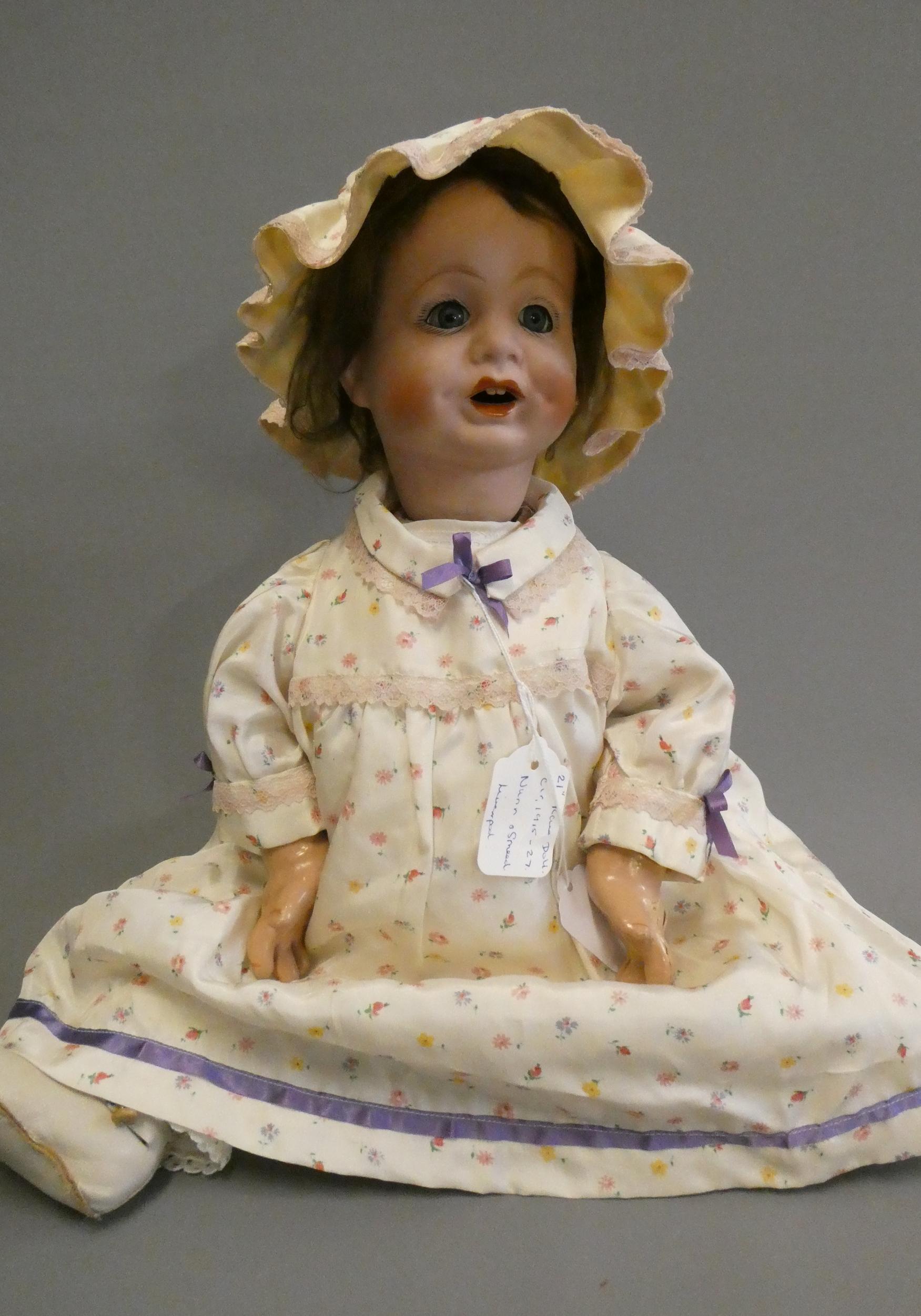 A "Nunsuch" Nunn & Smeed bisque British socket head doll, circa 1920, with blue glass fixed eyes, Image