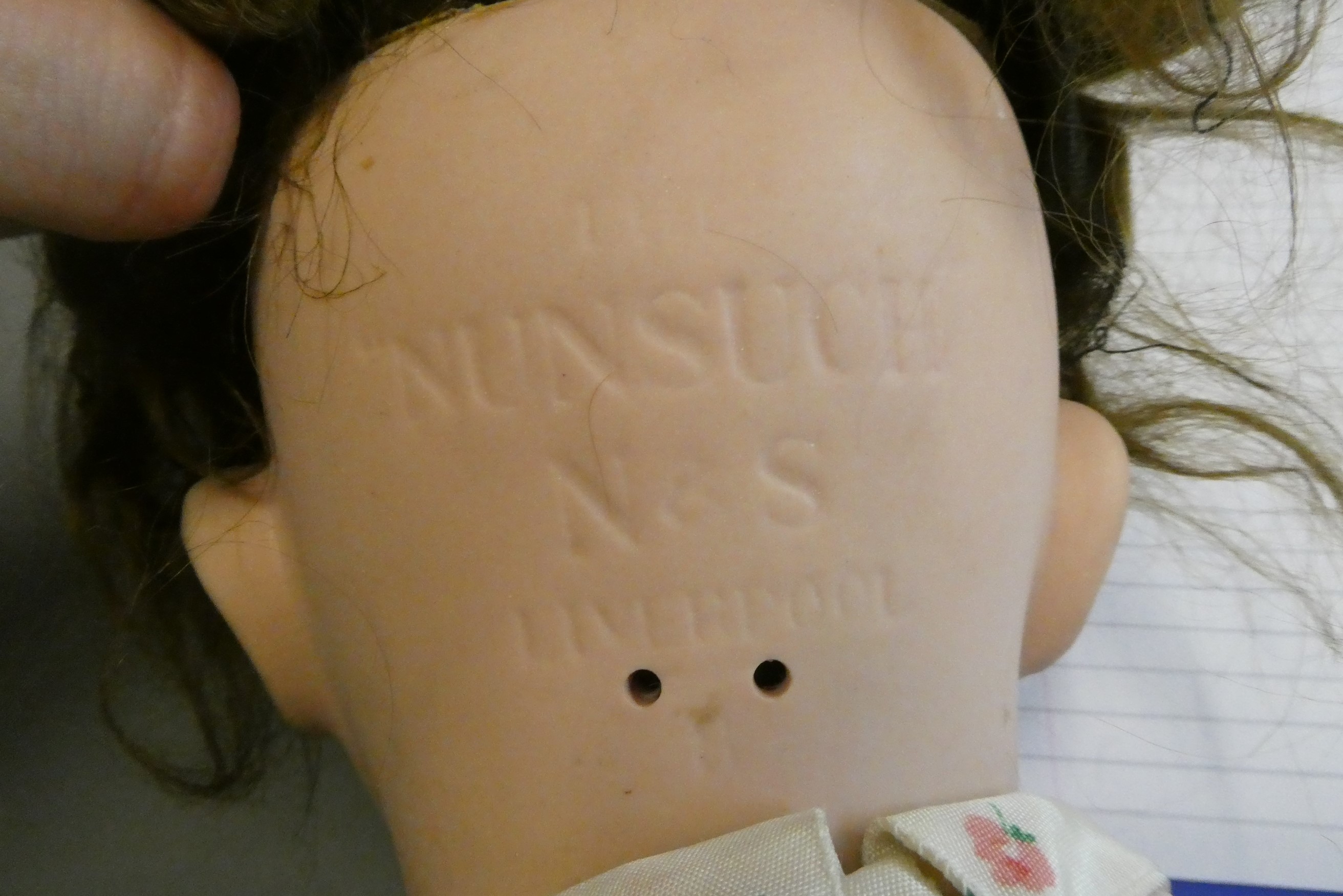 A "Nunsuch" Nunn & Smeed bisque British socket head doll, circa 1920, with blue glass fixed eyes, Image
