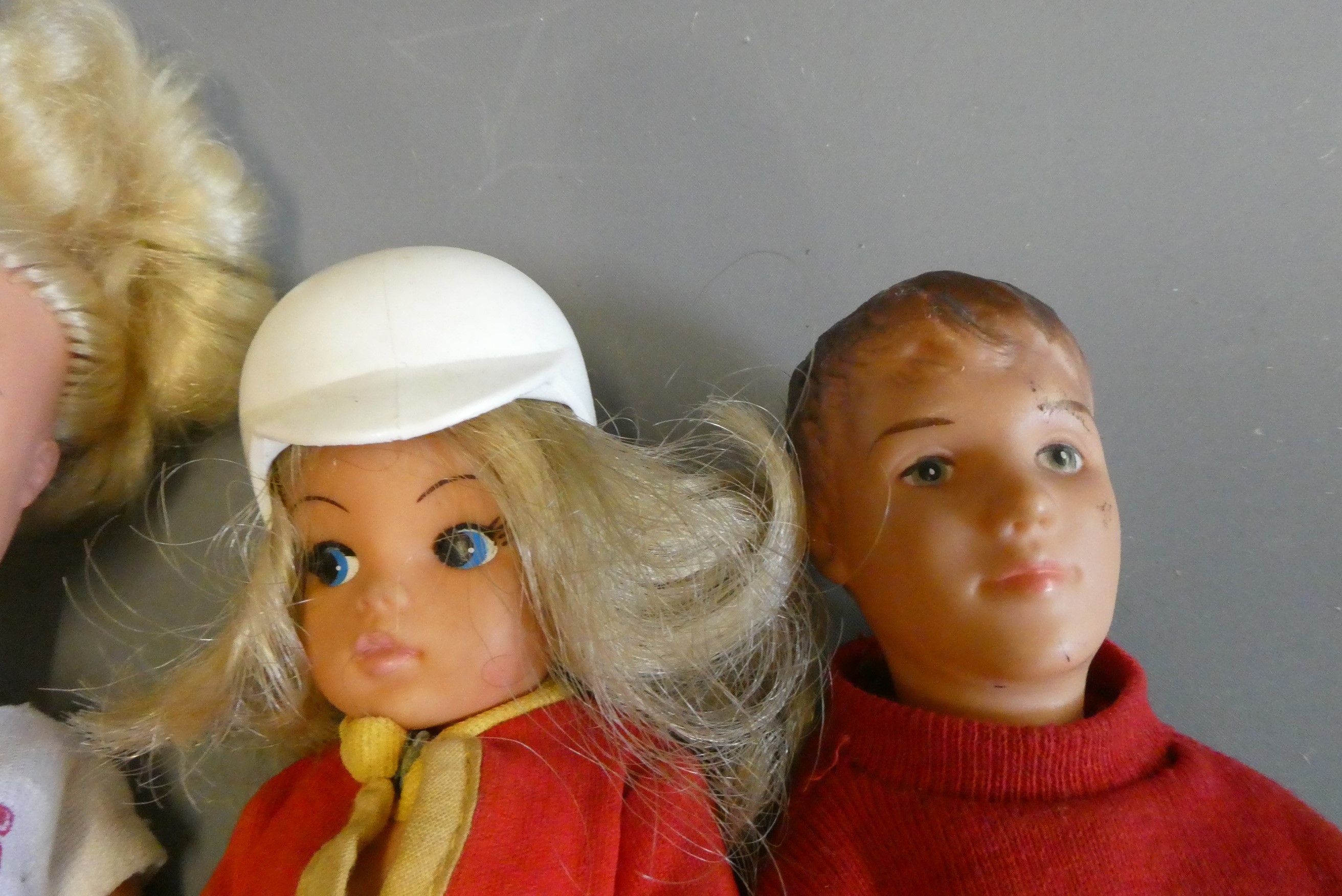 Vintage dolls comprising three Sindy dolls (one with scooter), a Pedigree Sindy Paul doll, and a Image