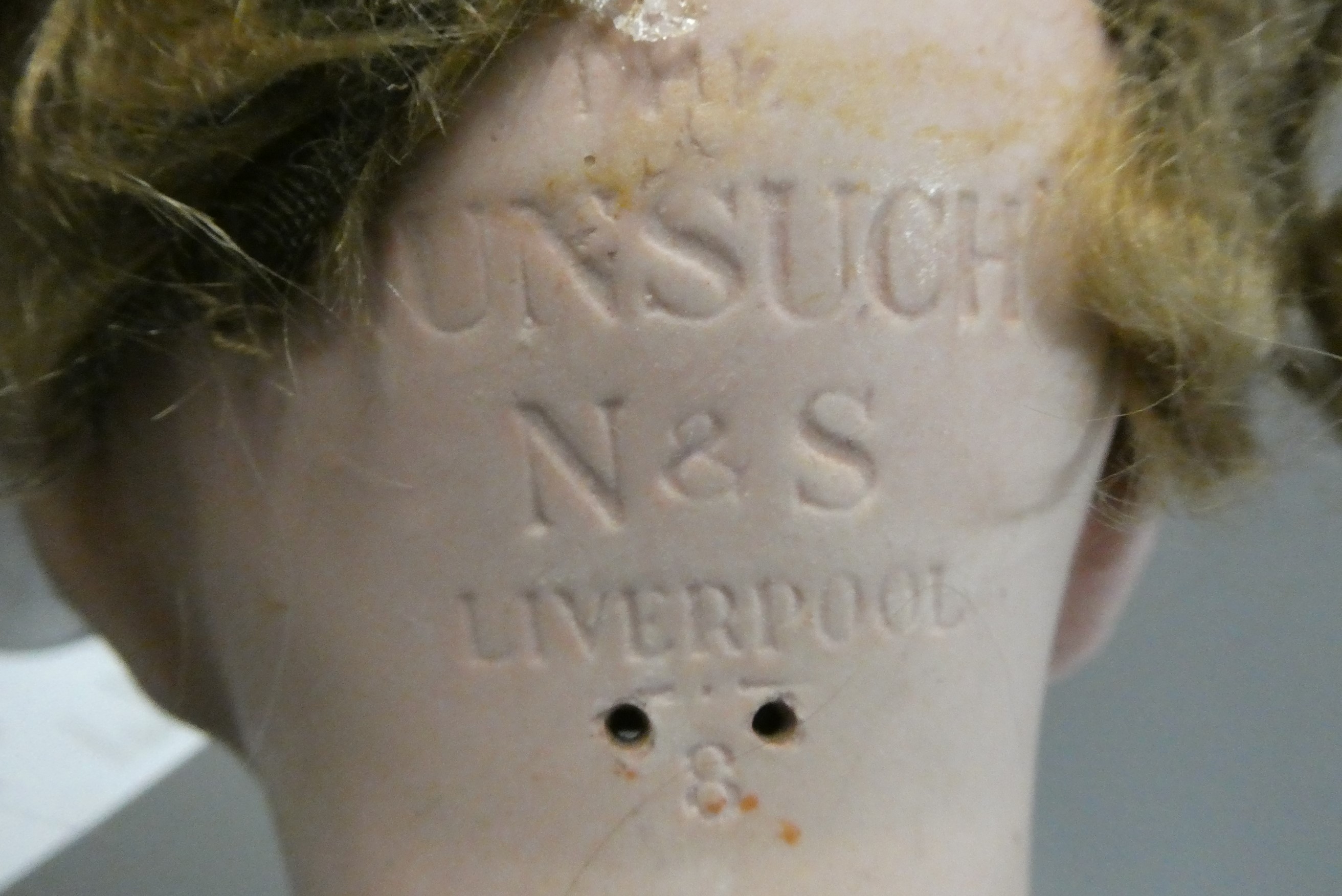 A "Nunsuch" Nunn & Smeed bisque British socket head doll, circa 1920, with blue glass fixed eyes, Image