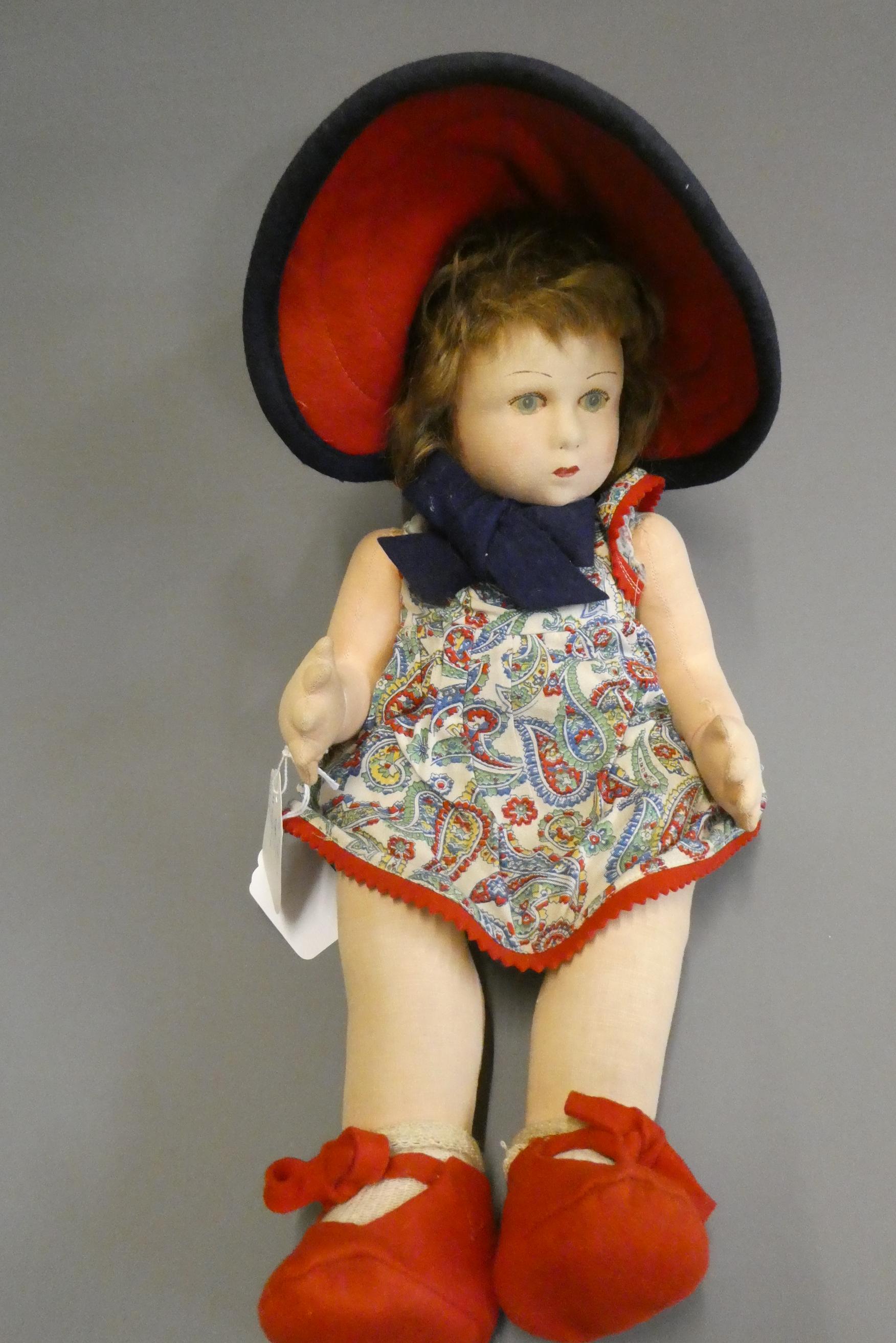 A Lenci girl doll, with fabric construction, painted features, original dress, felt shoes and hat, Image