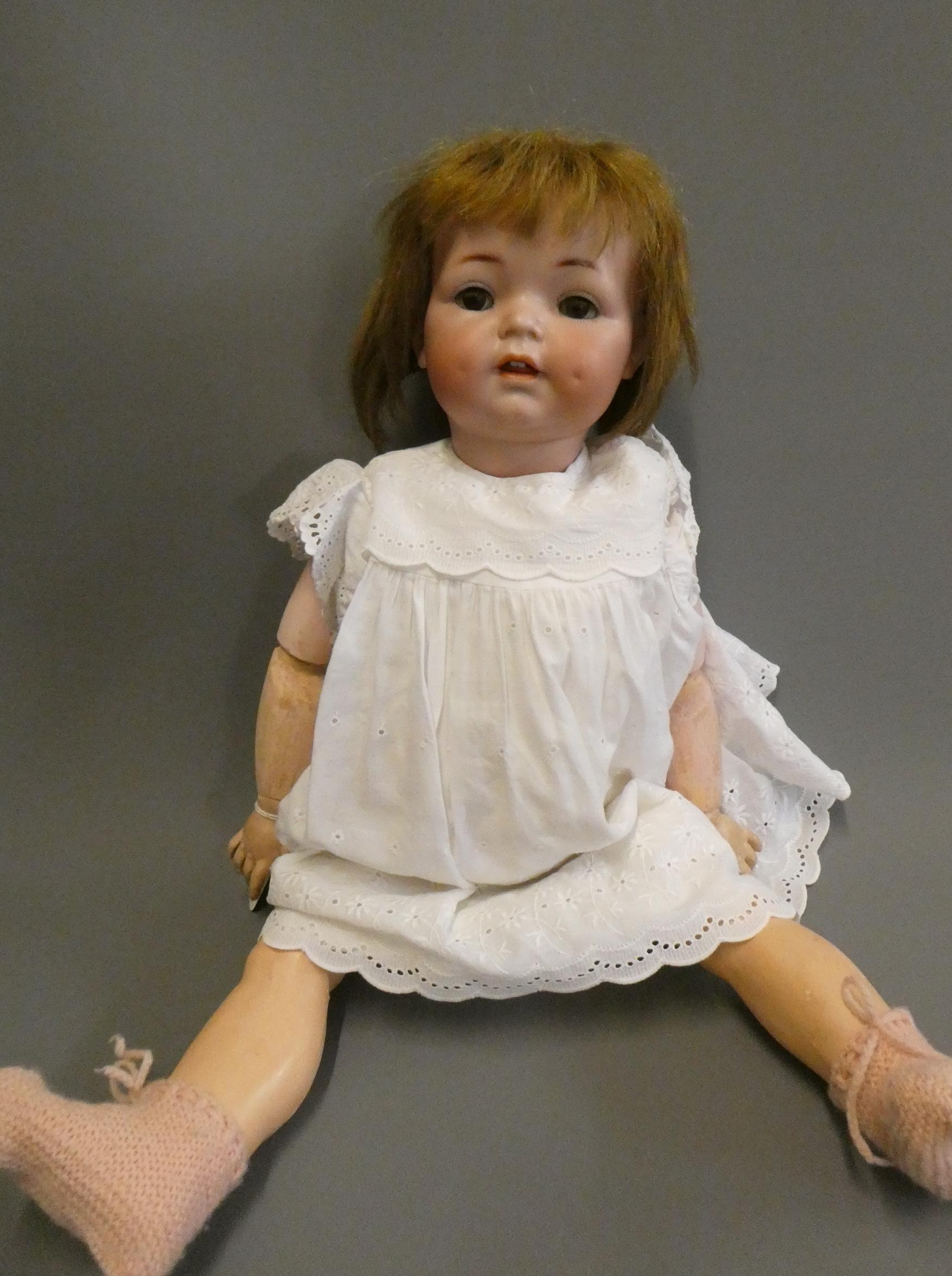 A Simon & Halbig K & R bisque socket head doll, with brown glass sleeping eyes, open mouth, applied Image