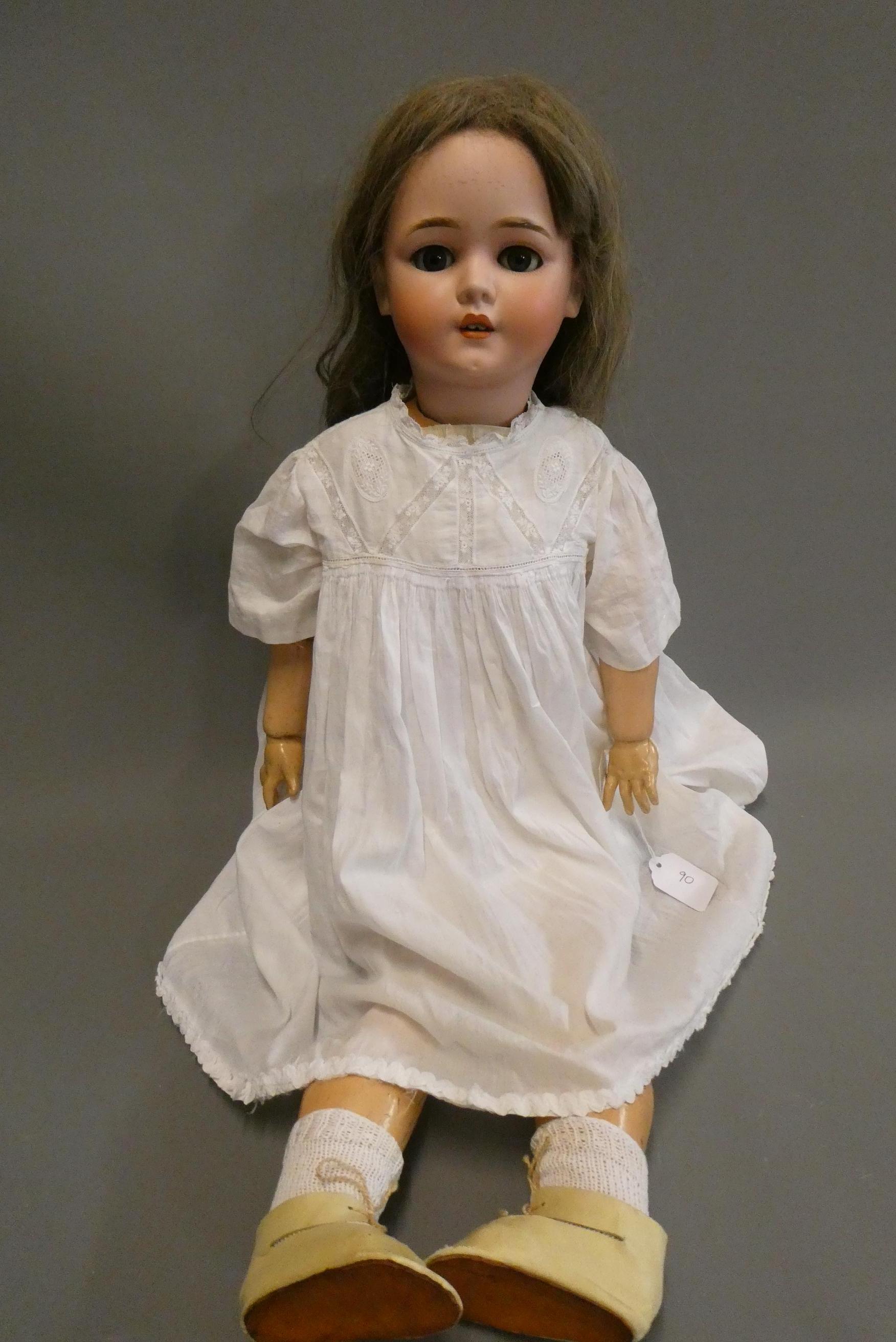 A Schoenau & Hoffmeister bisque socket head doll, with blue glass sleeping eyes, open mouth, teeth, Image