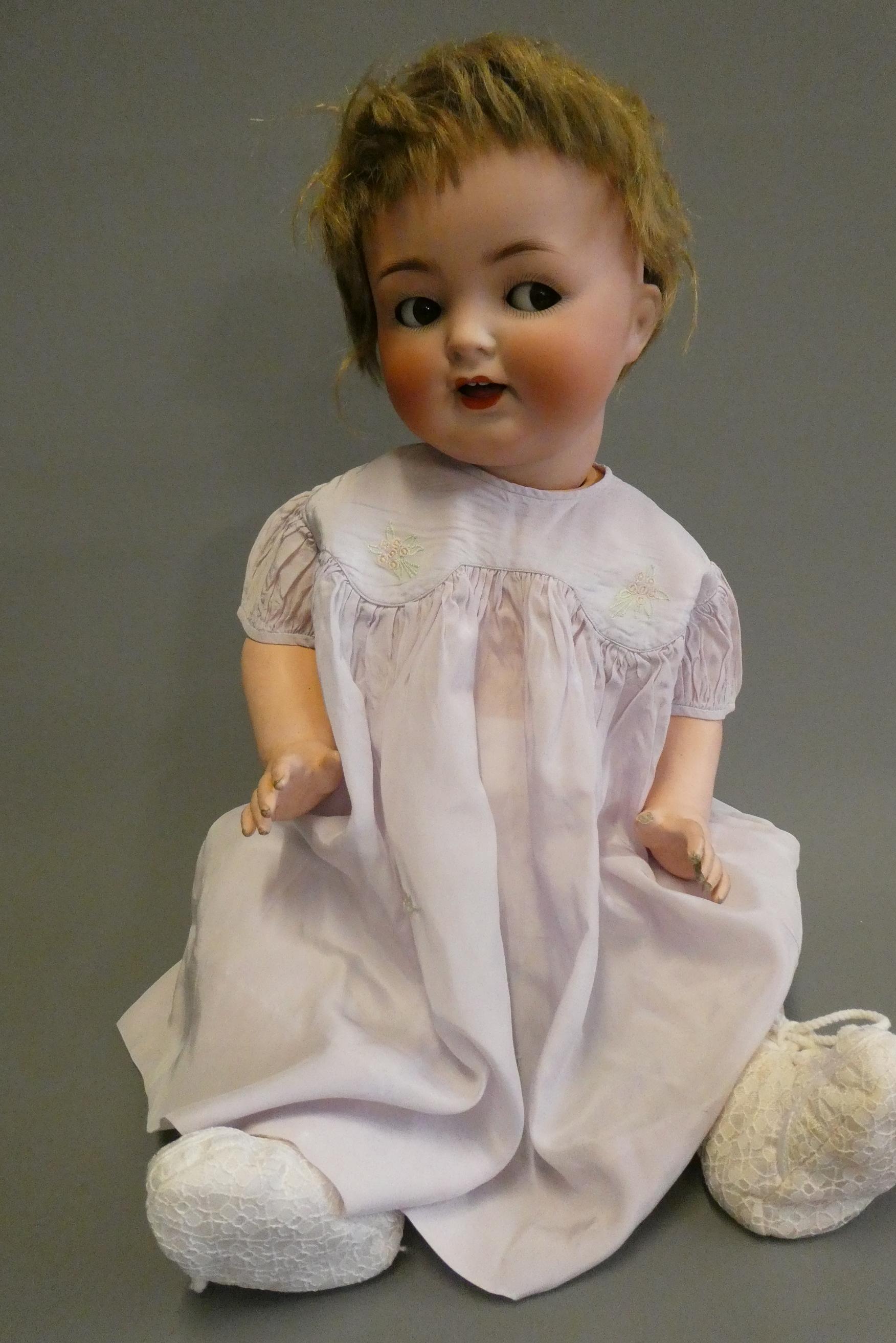 A Heubach Koppelsdorf bisque socket head flirty doll Image