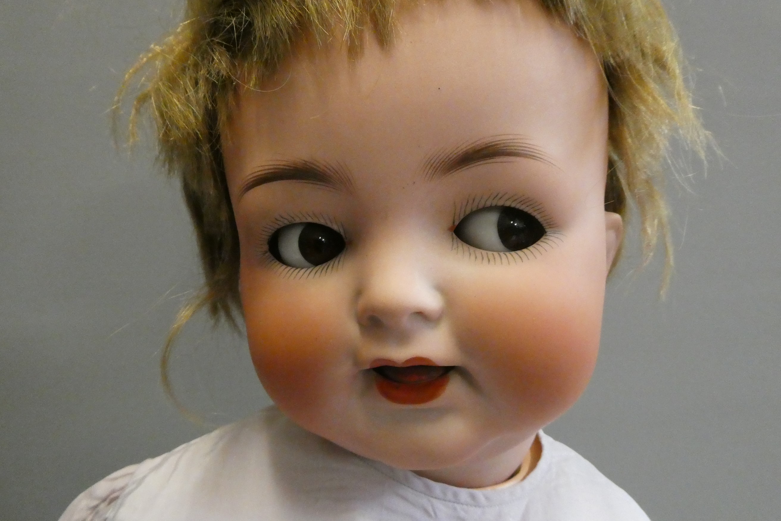 A Heubach Koppelsdorf bisque socket head flirty doll Image