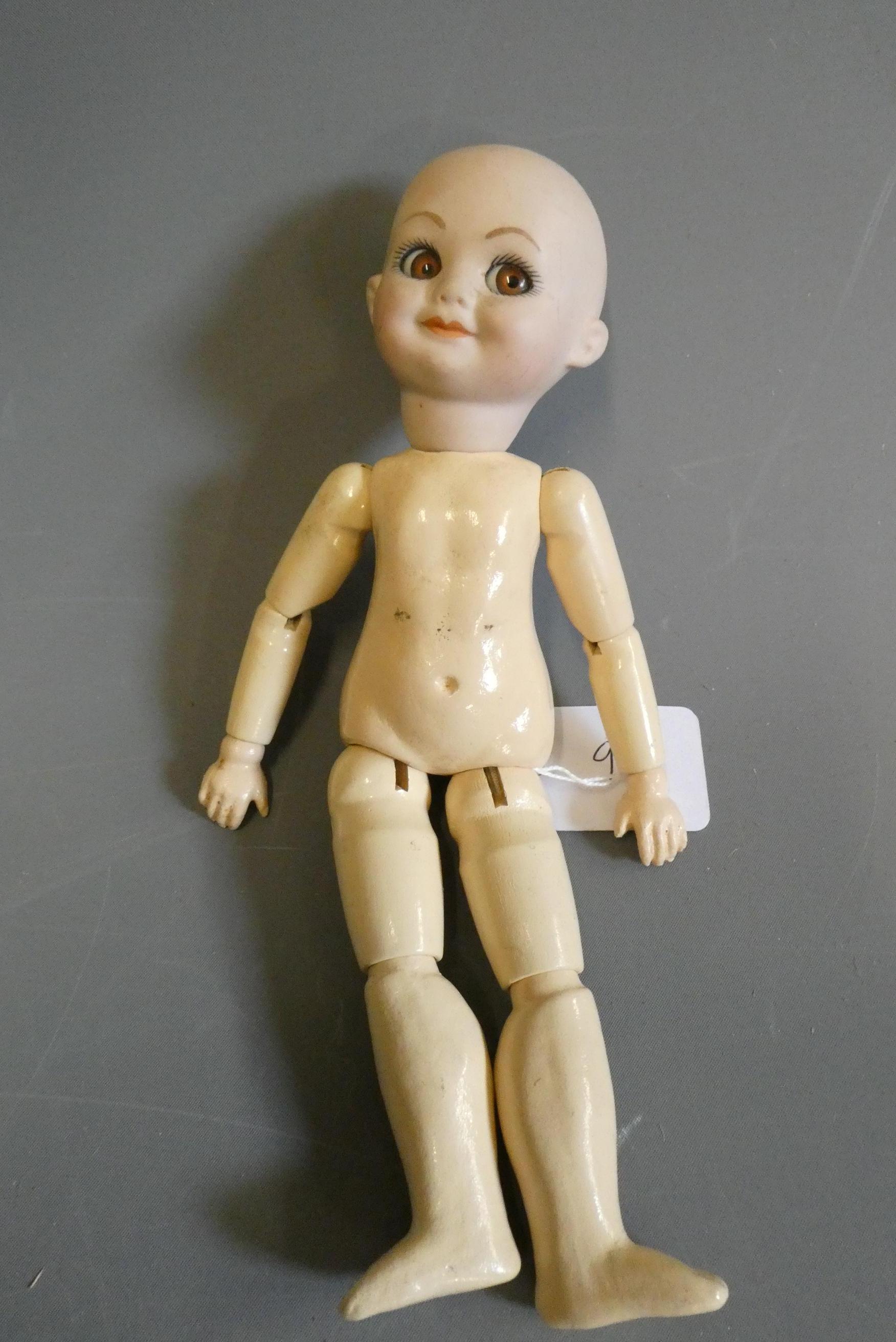 An Armand Marseille type bisque socket head character doll, with large sideways glancing glass eyes, Image