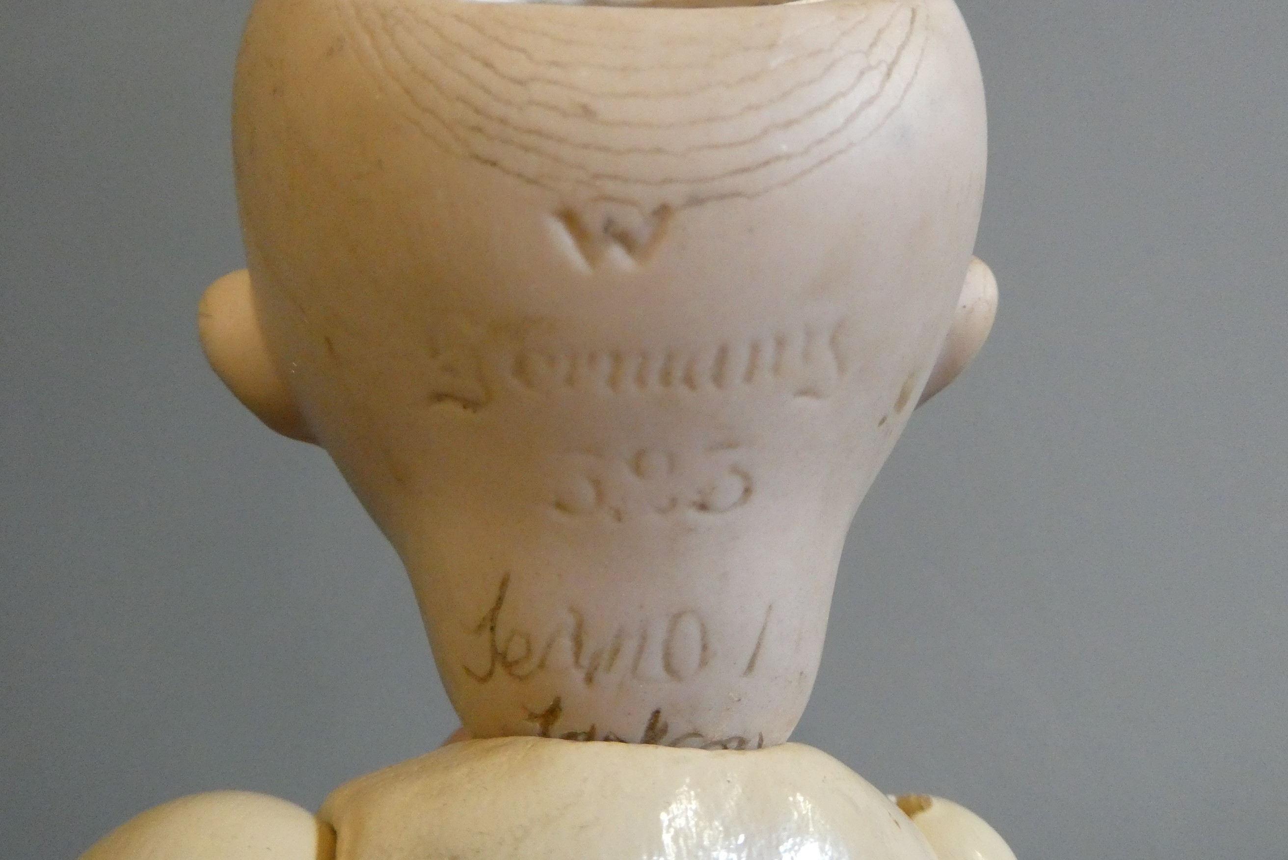 An Armand Marseille type bisque socket head character doll, with large sideways glancing glass eyes, Image