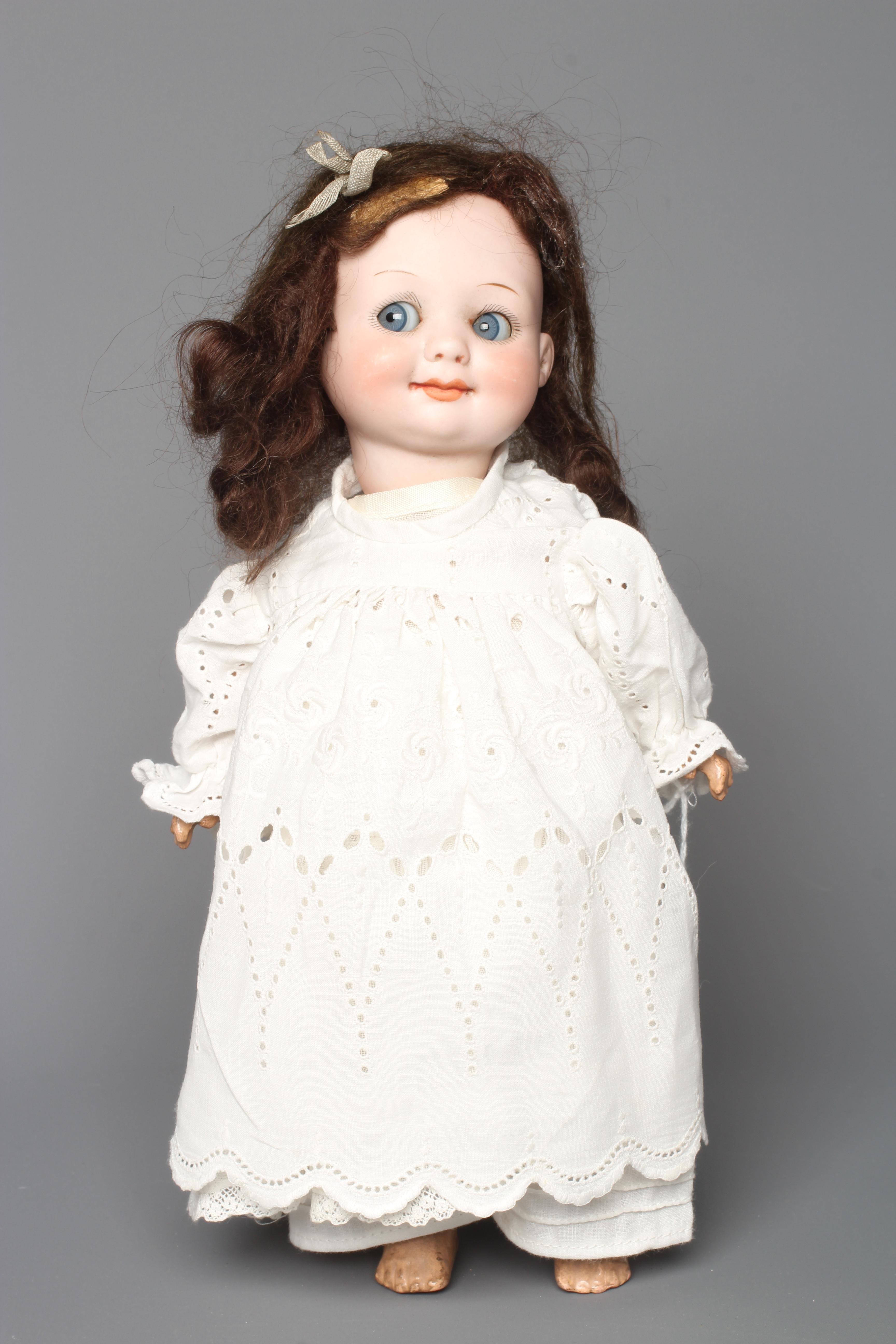 An Armand Marseille bisque socket head character doll, with sleeping sideways glancing "googly" Image
