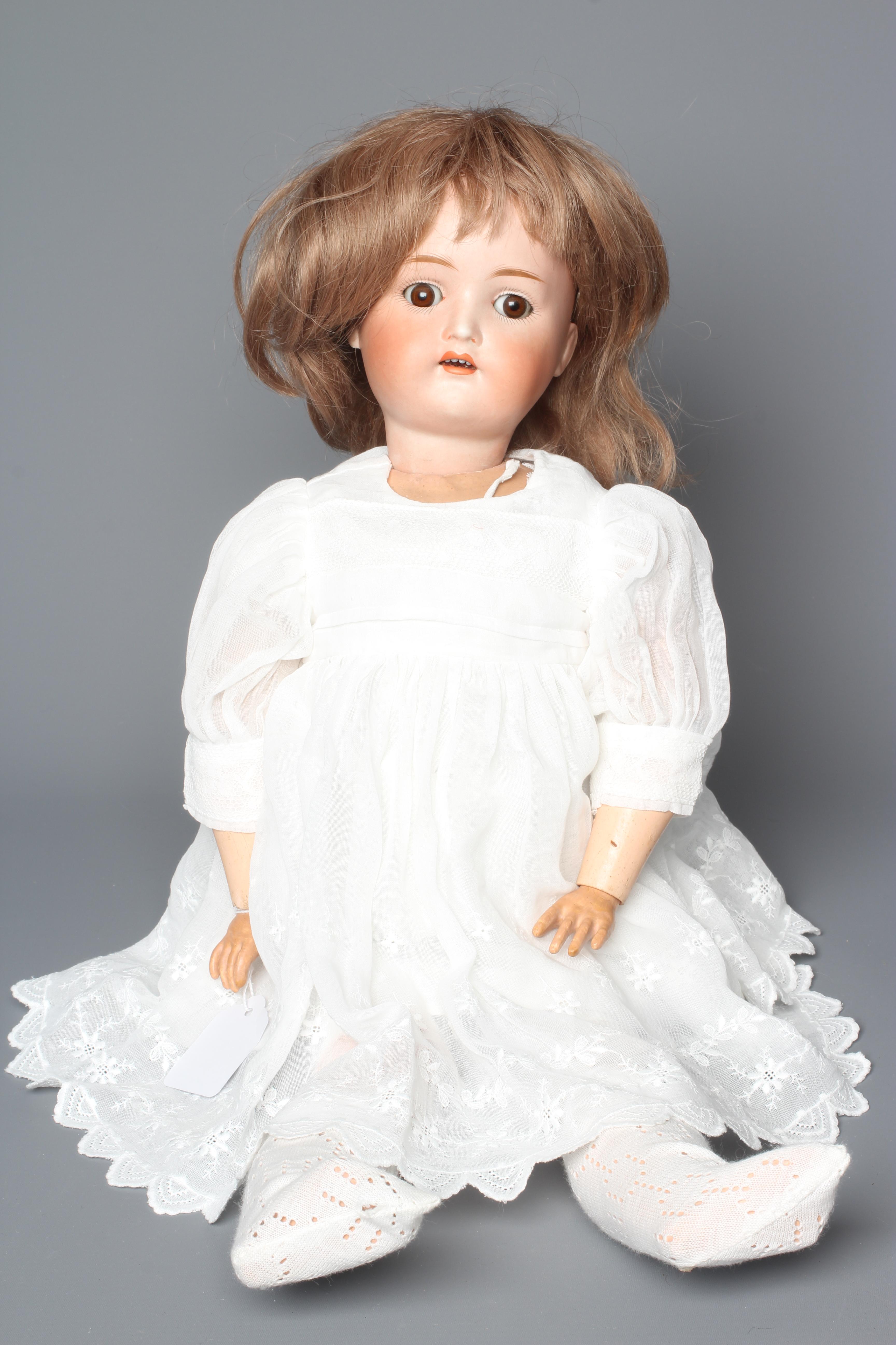A Kestner bisque socket head doll, with brown glass sleeping eyes, open mouth, applied teeth, wood Image