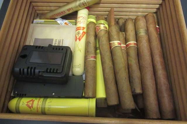 A large black adorini humidor with two keys Image