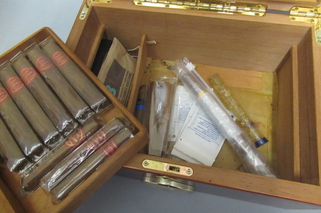 A large glass topped humidor Image