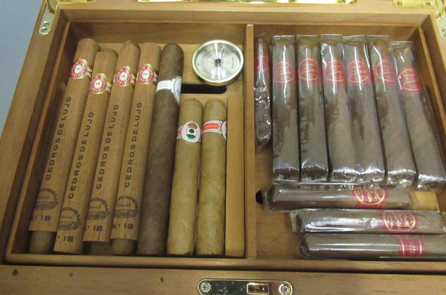 A large glass topped humidor Image