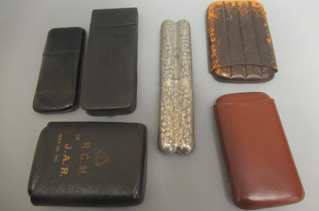 Six cigar cases Image