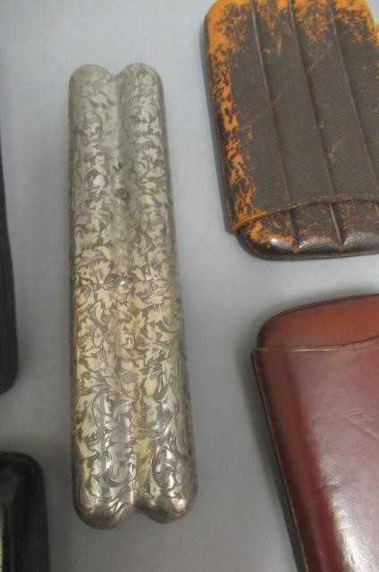 Six cigar cases Image