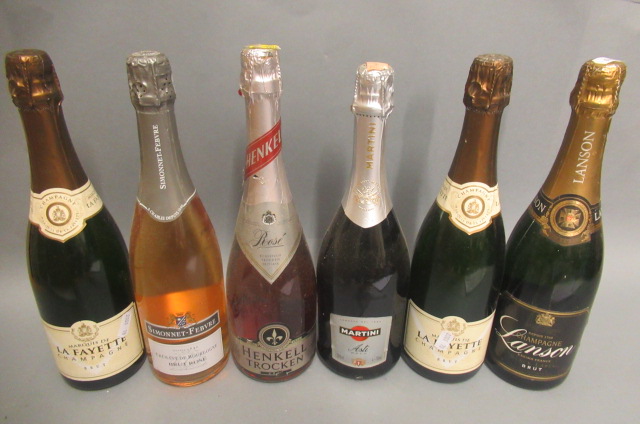 Six bottles of sparkling wine Image