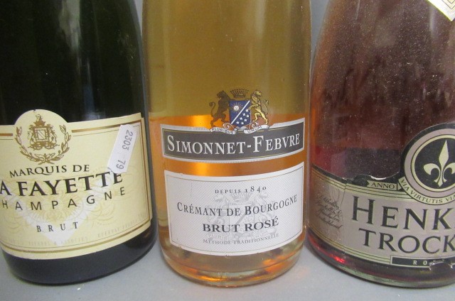 Six bottles of sparkling wine Image