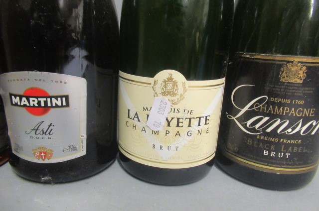 Six bottles of sparkling wine Image