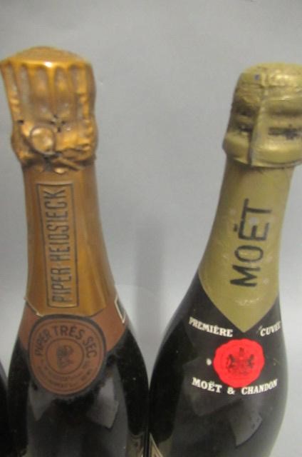 Three bottles of champagne Image