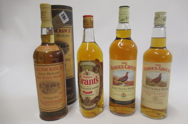Four bottles of whisky Image