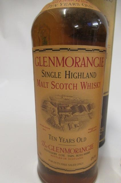 Four bottles of whisky Image