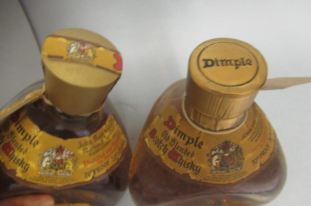 Two bottles Dimple old blended scotch whisky Image