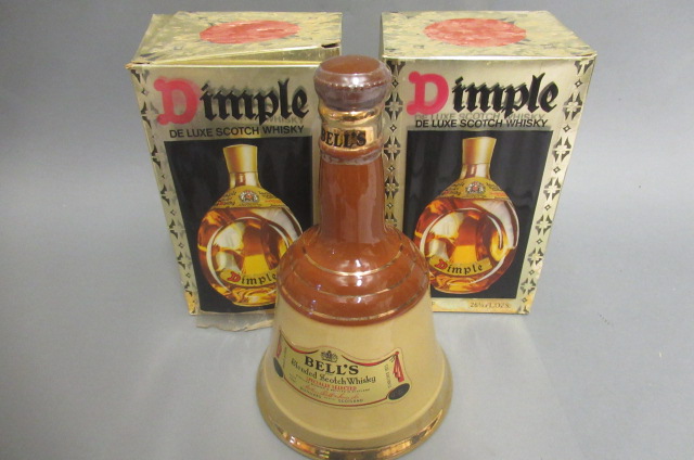Two boxed bottles of Dimple de luxe scotch whisky Image