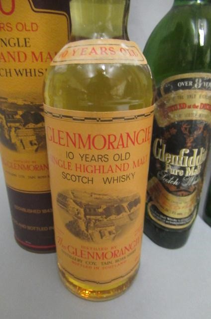 Four bottles of scotch whisky Image
