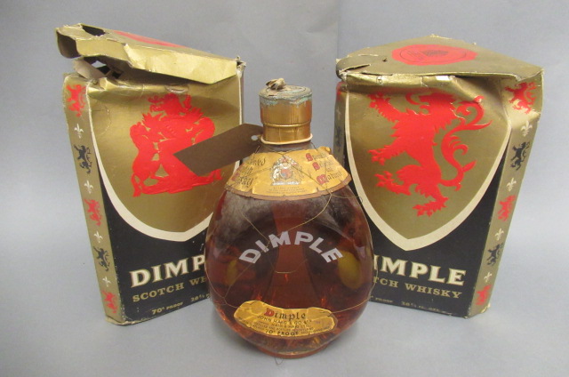 Three bottles Dimple old blended scotch whisky Image