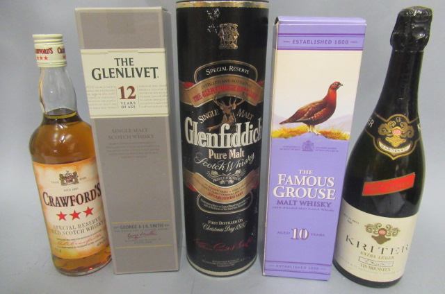 Four bottles of scotch whisky Image