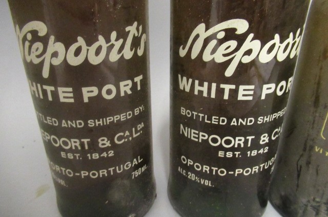 Four bottles of fortified wine Image