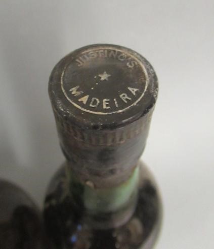 Four bottles of fortified wine Image
