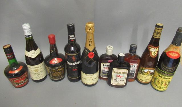 10 mixed bottles of alcohol Image