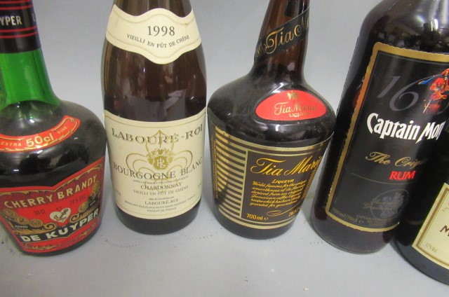 10 mixed bottles of alcohol Image