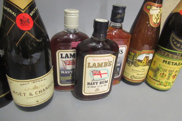 10 mixed bottles of alcohol Image