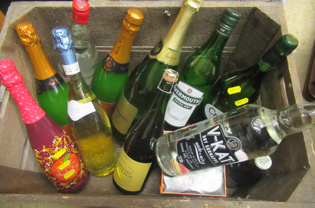 A crate of mixed wine and spirits Image