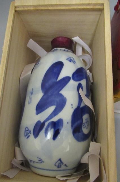 2 ceramic bottles of boxed rice wine (pagoda brand and other) Image
