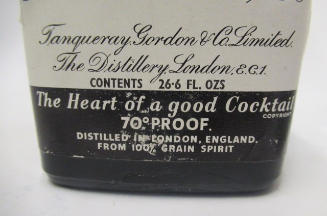 4 bottles of Gordons gin comprising 1 vintage 26.6fl.oz. snap cap top bottle Image