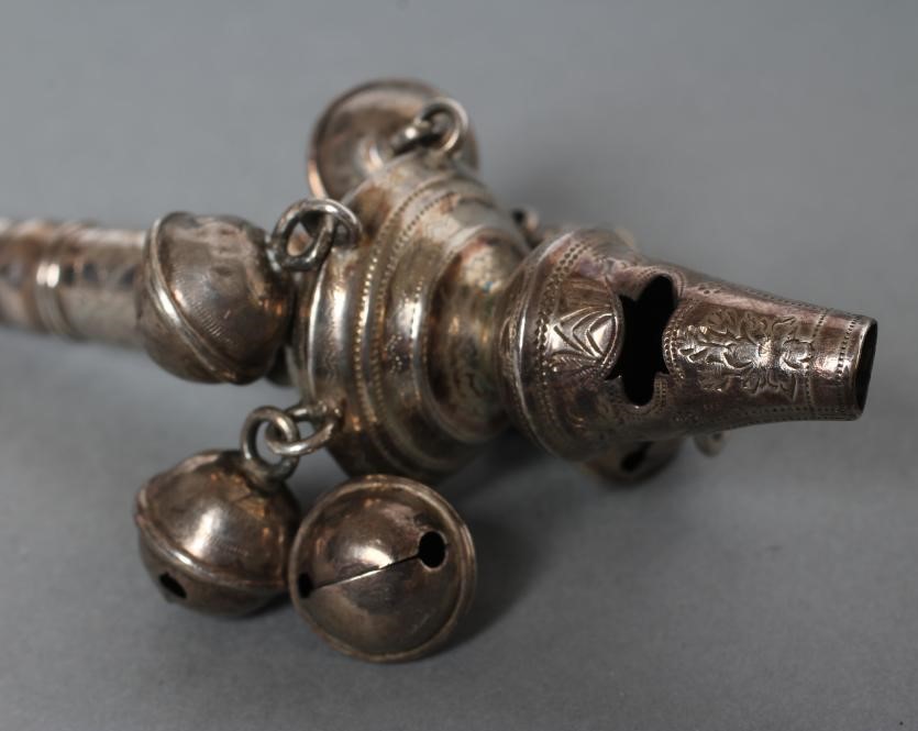 A LATE GEORGE III SILVER RATTLE/WHISTLE Image