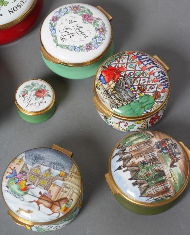 A COLLECTION OF EIGHT CRUMMLES ENAMEL BOXES including Christmas 1987/8/95 and Manor House Hotel Image