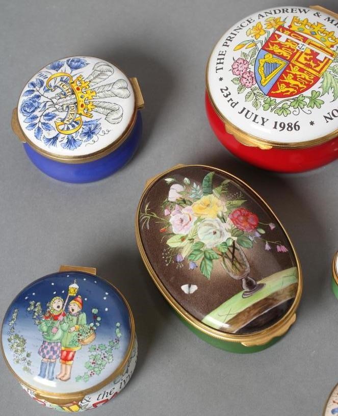 A COLLECTION OF EIGHT CRUMMLES ENAMEL BOXES including Christmas 1987/8/95 and Manor House Hotel Image