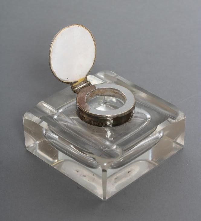 A SILVER MOUNTED INKWELL Image