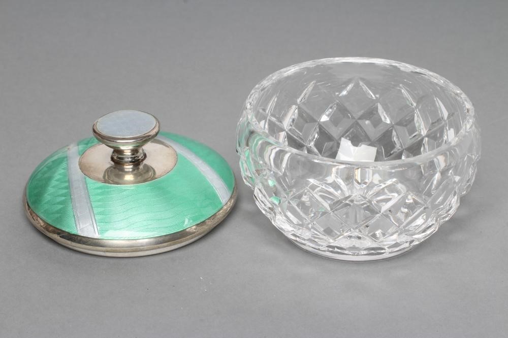 AN ART DECO CIRCULAR GLASS DRESSING TABLE JAR with silver cover Image