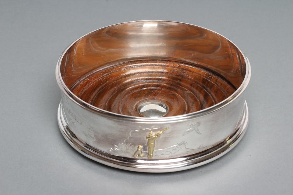 A SILVER BOTTLE COASTER Image