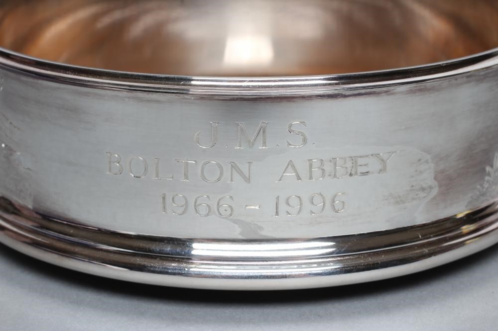 A SILVER BOTTLE COASTER Image