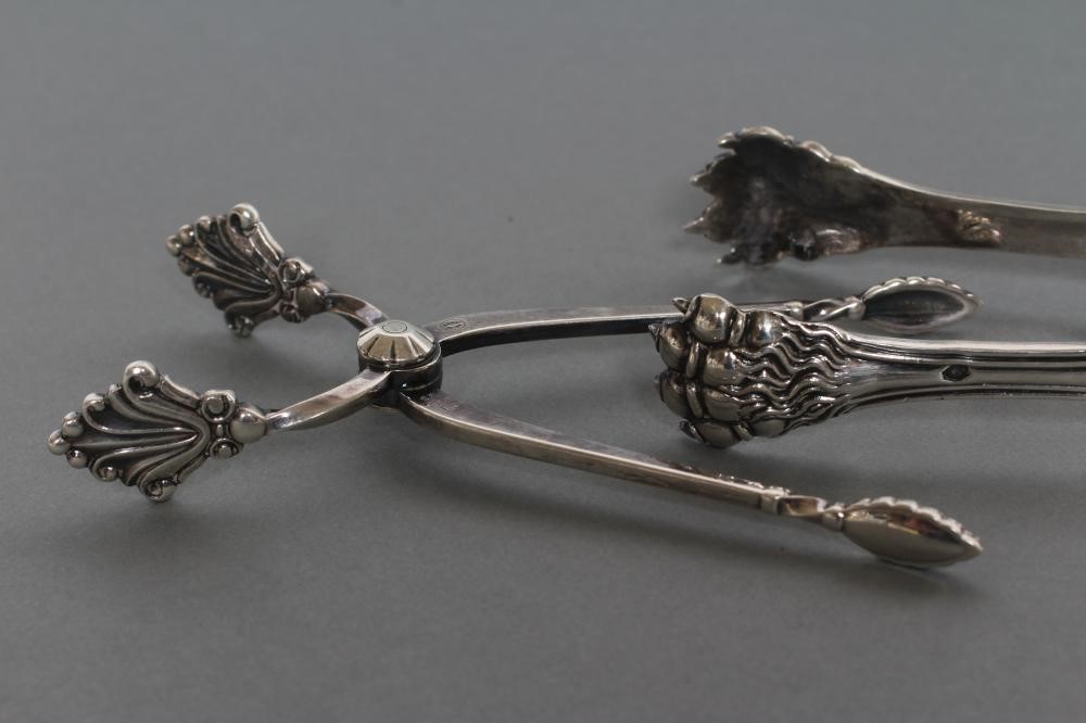 A PAIR OF SILVER SUGAR NIPS Image