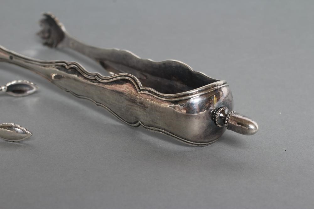 A PAIR OF SILVER SUGAR NIPS Image