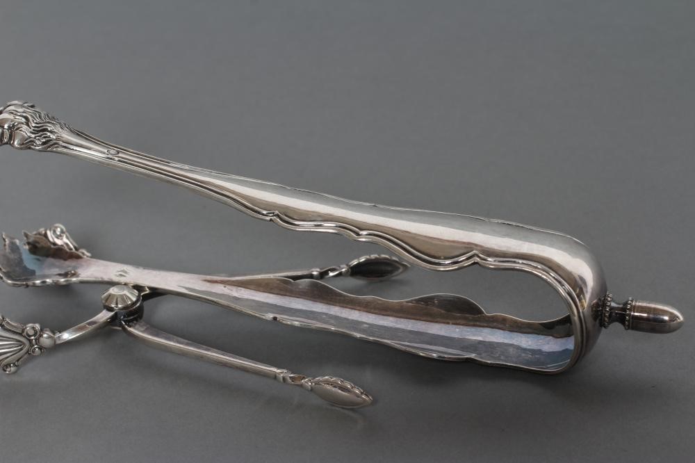 A PAIR OF SILVER SUGAR NIPS Image